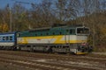 Passenger trains in station Kralovo Pole in Brno city in autumn color day