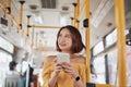 The passenger use smartphone in the bus or train, technology lifestyle, transportation and traveling concept Royalty Free Stock Photo