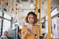 The passenger use smartphone in the bus or train, technology lifestyle, transportation and traveling concept Royalty Free Stock Photo