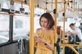 The passenger use smartphone in the bus or train, technology lifestyle, transportation and traveling concept Royalty Free Stock Photo