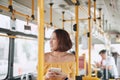 The passenger use smartphone in the bus or train, technology lifestyle, transportation and traveling concept Royalty Free Stock Photo