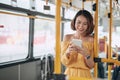 The passenger use smartphone in the bus or train, technology lifestyle, transportation and traveling concept Royalty Free Stock Photo