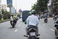 A passenger uses Grab moto-taxi services in a street of Ho Chi Minh City.