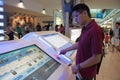 Passenger uses information stand in Dubai Airport