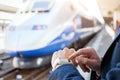 Passenger using smart watch at train station