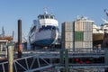 Passenger-vehicle ferry Edward V. Kramer hauled out next to storage containers