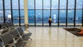 The passenger is waiting for the plane at the international airport, view through the window, travel concept Royalty Free Stock Photo