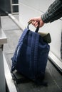 Passenger Weighing Luggage At Airport Check In Royalty Free Stock Photo