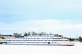 Passenger white liner in frozen river covered