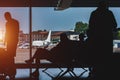 Passengers in the airport lounge are waiting for boarding a plane Royalty Free Stock Photo