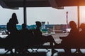 Passengers in the airport lounge are waiting for boarding a plane Royalty Free Stock Photo