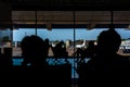 Passengers in the airport lounge are waiting for boarding a plane Royalty Free Stock Photo