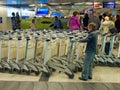 Passengers in the baggage reclaim hall of Vnukovo Airport, Moscow, Russia