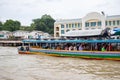 Passengers in Bangkok express boat in Chao Phraya river