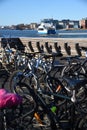 Passengers bicycles parked against a backdrop of the passenger ferry in the harbour. Gothenburg Sweden.