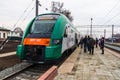 Passengers board a diesel train of the Belarusian railway PESA 7