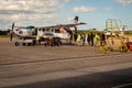 Passengers board small Tropic Air Airplane departing from Philip S W Goldson Airport in Belize, Central America