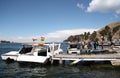 Passengers board a tourist boat at Titicaca lake, Bolivia