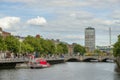 Passengers boarding a recreational boat with a tourist voyage through the Liffey River