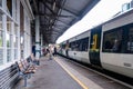 Passengers Boarding A Southern Rail Train At Epsom Station