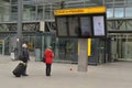 Passengers Check information board Heathrow Airport