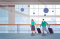 passengers couple with baggage businesspeople standing with luggage traveling concept airport terminal interior Royalty Free Stock Photo