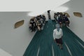 Passengers and crew travel on pandemic airplane wearing face mask against covid or influenza while stewardess man and woman offer Royalty Free Stock Photo