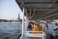 Passengers cross the Chao Phraya river by using passenger boat services in Bangkok