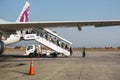 Passengers disembarking from a Qatar Airways flight at Tribhuvan International Airport.