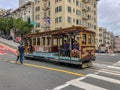 Passengers enjoying a ride in a cable car in San Francisco Royalty Free Stock Photo