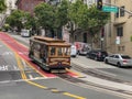 Passengers enjoying a ride in a cable car in San Francisco Royalty Free Stock Photo