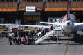 Passengers getting in an airport at terminal