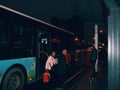 passengers getting off bus at bus station in Wuhan city china