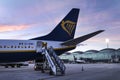 Passengers getting off the plane of Ryanair company at Alicante Airport