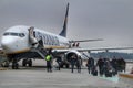 Passengers getting off the plane of Ryanair company at the Porto airport