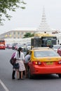 Passengers gettng in a taxi Royalty Free Stock Photo