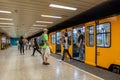 Passengers going out of the yellow train wagons of the Budapest subway Royalty Free Stock Photo