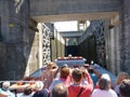 passengers inside the boat making a tourist circuit along the Douro river at the moment they are in the lift system through locks.