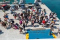 Passengers leave the ferry, at the port on the island of Iraklia Greece.