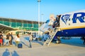 passengers leaving airplane, ladder, airport