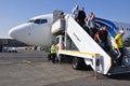 Passengers leaving airplane Royalty Free Stock Photo