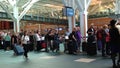 Passengers long line up for waiting check in counter at YVR airport