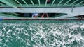 passengers looking through the ferry window