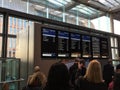 Passengers looking at the train information. UK Royalty Free Stock Photo