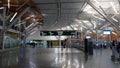 Passengers with luggage inside YVR airport in Vancouver BC Canada