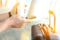 Passengers with luggage waiting at the airport/ Passenger using mobile phone and drink coffee Royalty Free Stock Photo