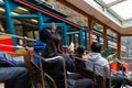 Passengers on open air train greeting other car passengers during travel in Japan Royalty Free Stock Photo