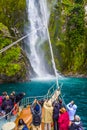 Passengers photograph the waterfall