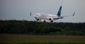 Passengers plane Boeing 737-900ER on the Boryspil airport apron runway. Ukraine International Airlines planes.