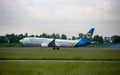 Passengers plane Boeing 737-900ER on the Boryspil airport apron runway. Ukraine International Airlines planes.